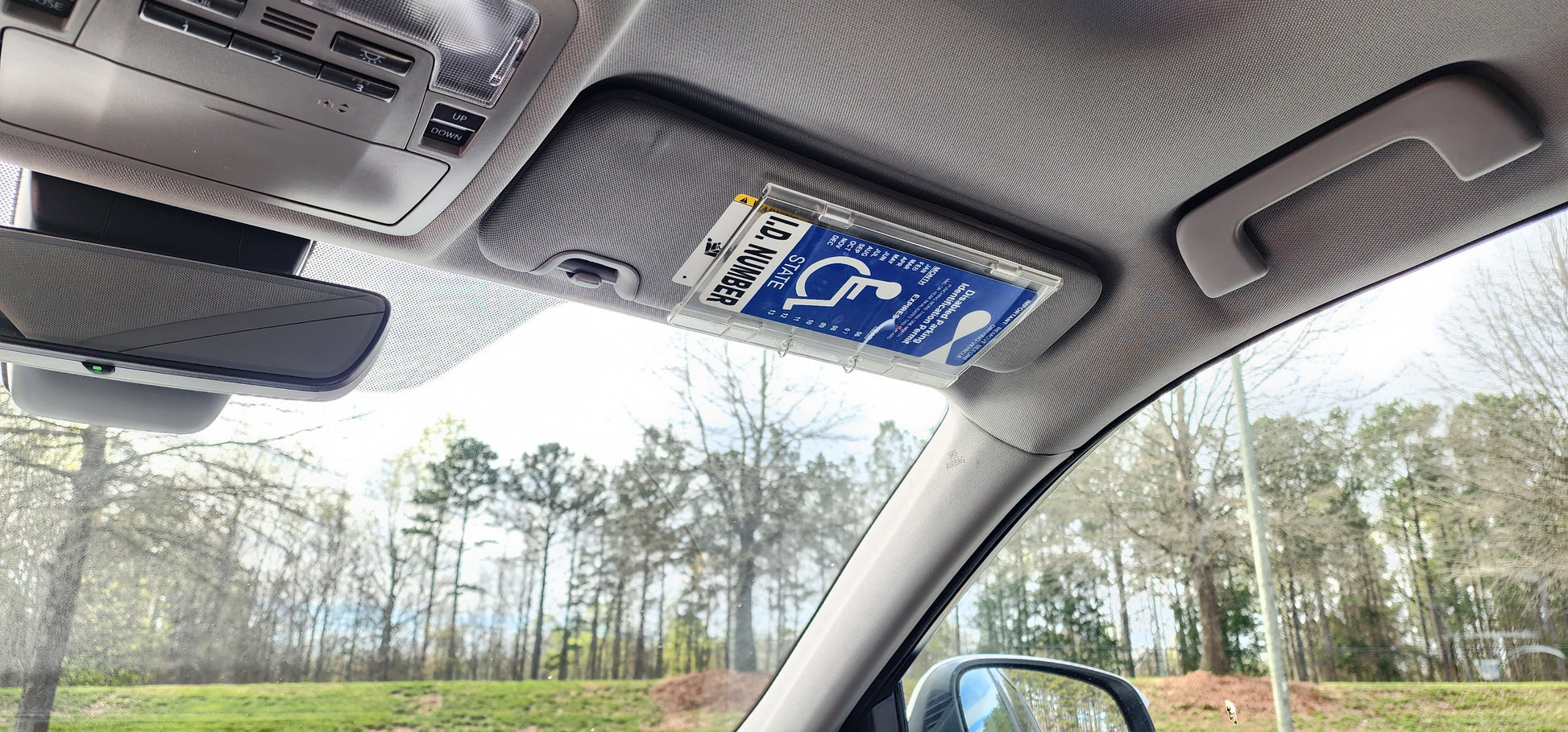 conveniently stored handicap parking ID. visor mount parking hang tag holder. Magnetically held