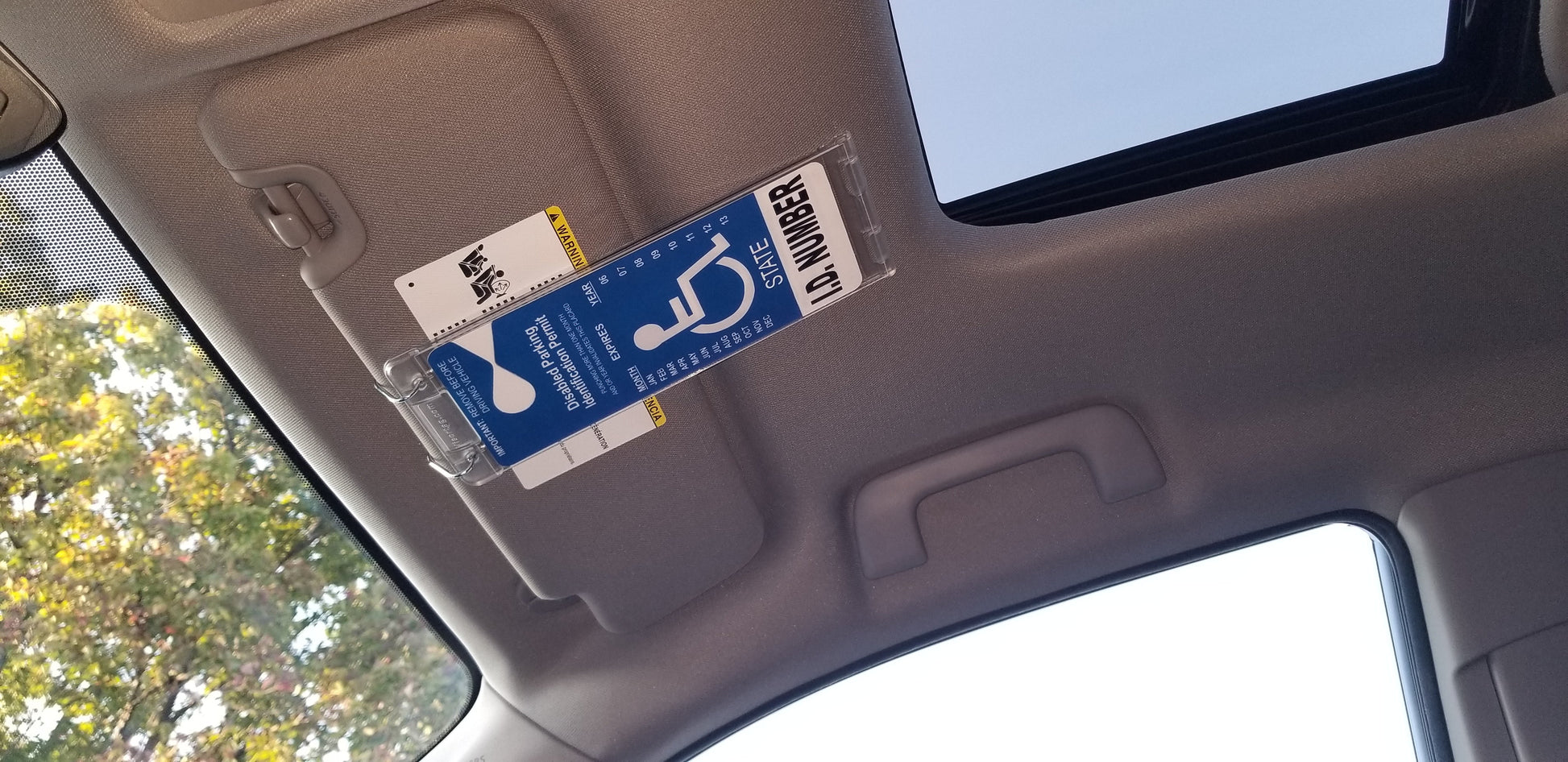 Disabled Parking Permit Holder Hanger Sleeve. Hard plastic for highest summer heat