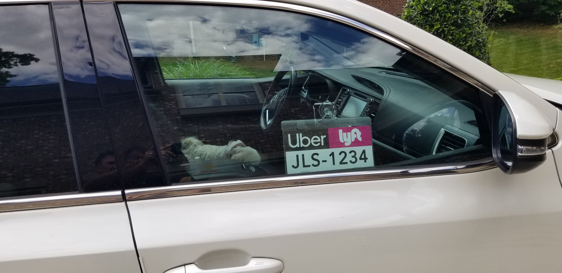 Uber and Lyft emblem holder display on passenger side window. Uber Lyft logo and license plate number and driver name
