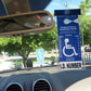 Handicap parking placard holder attached to magnet charm